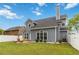 This home boasts a large backyard, white fence, and a charming patio area, perfect for outdoor enjoyment and entertaining at 900 Hillary Ln, Lawrenceville, GA 30043