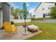 Landscaped backyard with a patio area and comfortable seating arrangement at 900 Hillary Ln, Lawrenceville, GA 30043