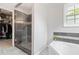 Bathroom featuring a tiled shower, walk-in closet, and garden tub at 900 Hillary Ln, Lawrenceville, GA 30043