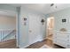 Upstairs bedroom showcasing neutral walls, hardwood floors, and easy access to the bathroom at 900 Hillary Ln, Lawrenceville, GA 30043