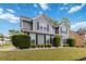View of a gray two-story home, showcasing its well-maintained exterior and inviting curb appeal at 900 Hillary Ln, Lawrenceville, GA 30043