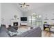 Bright living room featuring a fireplace, large windows, and a cozy sectional sofa at 900 Hillary Ln, Lawrenceville, GA 30043