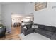 Inviting living room featuring a spacious sectional sofa, high ceilings, and an open connection to the kitchen at 900 Hillary Ln, Lawrenceville, GA 30043