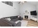 Spacious living room with vaulted ceiling, a fireplace, comfortable seating, and natural light at 900 Hillary Ln, Lawrenceville, GA 30043