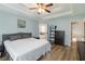 Spacious main bedroom suite with tray ceilings, hardwood floors and ensuite bathroom at 900 Hillary Ln, Lawrenceville, GA 30043