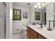 Bright bathroom features ample lighting, a walk-in shower, and a wooden vanity at 9295 Martin Rd, Roswell, GA 30076