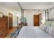 Bedroom with antique furnishings and a four-poster bed, adding character and charm at 9295 Martin Rd, Roswell, GA 30076