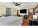 Spacious bedroom includes a ceiling fan, closet, and hardwood floors at 9295 Martin Rd, Roswell, GA 30076