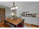 Inviting dining area with hardwood floors, seamlessly connecting to the kitchen at 9295 Martin Rd, Roswell, GA 30076