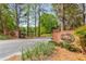 Martin's Landing brick entrance sign with landscaping and wrought iron gate leading to the neighborhood at 9295 Martin Rd, Roswell, GA 30076