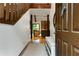 Warm and inviting entryway with hardwood floors, open staircase, and a glimpse into the cozy living space at 9295 Martin Rd, Roswell, GA 30076