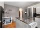 Well-lit kitchen features stainless steel appliances, center island, and seamless entry into the rest of the home at 9295 Martin Rd, Roswell, GA 30076