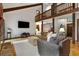 Spacious living room with hardwood floors, vaulted ceilings, and a balcony overlooking the open-concept design at 9295 Martin Rd, Roswell, GA 30076