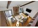 Spacious living room with a stone fireplace, wood floors, and sliding doors to the outside at 9295 Martin Rd, Roswell, GA 30076