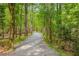 Gravel walking trail winding through a lush green forest, perfect for an outdoor stroll at 9295 Martin Rd, Roswell, GA 30076