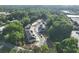 Aerial view showcasing the community layout, including townhomes and lush greenery, offering a sense of space at 166 Bluffington Way, Marietta, GA 30066