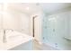 Bright bathroom featuring double sinks and a glass-enclosed shower with tile surround at 166 Bluffington Way, Marietta, GA 30066