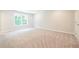 Spacious bedroom with carpet and a large window overlooking the yard at 166 Bluffington Way, Marietta, GA 30066