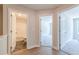 Bright hallway with hardwood floors and access to bathroom and bedrooms at 166 Bluffington Way, Marietta, GA 30066