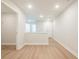 Hallway with light vinyl floors leading to other rooms, showcasing the home's layout and design at 166 Bluffington Way, Marietta, GA 30066