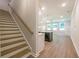 View of a living room and kitchen, emphasizing the open floor plan and modern finishes at 166 Bluffington Way, Marietta, GA 30066