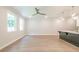 Spacious open floor plan with wood floors, modern lighting, and large windows overlooking the outside at 166 Bluffington Way, Marietta, GA 30066