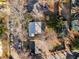 Aerial view of the property and neighborhood showcasing the backyard, mature trees, and surrounding homes at 1763 Delaware Ne Ave, Atlanta, GA 30307