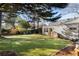 Expansive backyard features lush lawn, stepping stones, and mature trees for outdoor enjoyment at 1763 Delaware Ne Ave, Atlanta, GA 30307
