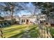 Well-maintained backyard showcasing a lush green lawn, stepping stone path, and a charming outdoor living space at 1763 Delaware Ne Ave, Atlanta, GA 30307