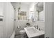 Classic bathroom features subway tile, black and white floor tiles and traditional fixtures at 1763 Delaware Ne Ave, Atlanta, GA 30307