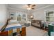 Light-filled Bedroom with large windows, ceiling fan and neutral decor is perfect for a new Gathering at 1763 Delaware Ne Ave, Atlanta, GA 30307