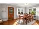 Dining room features hardwood floors, large windows, light gray walls and a wooden table and chairs at 1763 Delaware Ne Ave, Atlanta, GA 30307