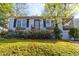 Charming front exterior with manicured lawn, flower boxes, black shutters, and an inviting entrance at 1763 Delaware Ne Ave, Atlanta, GA 30307