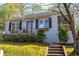 Charming bungalow with gray painted brick, a landscaped front yard, and inviting curb appeal at 1763 Delaware Ne Ave, Atlanta, GA 30307