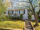 Charming home with a well-manicured front yard, garden boxes, and inviting entrance steps at 1763 Delaware Ne Ave, Atlanta, GA 30307