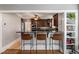 Open concept kitchen with bar seating, stainless steel appliances, and granite countertops at 1763 Delaware Ne Ave, Atlanta, GA 30307