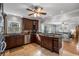 Well-lit kitchen featuring stainless steel appliances, granite countertops, tile floors, and seamlessly connected to the living room at 1763 Delaware Ne Ave, Atlanta, GA 30307