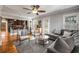 Open concept living area flowing into a kitchen with an eat-in bar at 1763 Delaware Ne Ave, Atlanta, GA 30307
