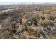 Aerial view of neighborhood and cityscape showcasing residential area and downtown skyline in the distance at 1763 Delaware Ne Ave, Atlanta, GA 30307