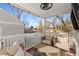Relaxing screened porch with seating and view of the backyard is perfect for enjoying the outdoors at 1763 Delaware Ne Ave, Atlanta, GA 30307