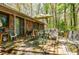 An inviting back deck with seating overlooks a serene, wooded lot, perfect for relaxation at 2680 Irene Dr, Marietta, GA 30066