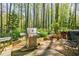 The backyard offers plenty of space for outdoor cooking, dining, and relaxing in nature at 2680 Irene Dr, Marietta, GA 30066