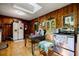 Kitchen featuring wood paneling, laminate wood flooring, a stainless steel oven, and a skylight at 2680 Irene Dr, Marietta, GA 30066