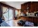 Kitchen with wood paneling, laminate wood flooring, and sliding glass doors to the exterior at 2680 Irene Dr, Marietta, GA 30066