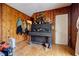 A living room features wood paneling, laminate wood flooring, and piano at 2680 Irene Dr, Marietta, GA 30066