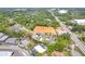 Aerial view of the property showing surrounding roadways, trees, and neighboring houses at 409 Thunder Rd, Buford, GA 30518