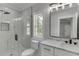 Modern bathroom featuring marble countertop, glass shower, and modern fixtures at 409 Thunder Rd, Buford, GA 30518