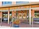 The building has an inviting entrance with wood doors, seasonal wreaths, and potted flowers along a brick walkway at 409 Thunder Rd, Buford, GA 30518
