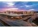 Buford High School has modern architecture, set against a dramatic sunset, with well-maintained grounds at 409 Thunder Rd, Buford, GA 30518