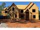 Two story home with a multi-gabled roofline and exposed wood frame at 409 Thunder Rd, Buford, GA 30518